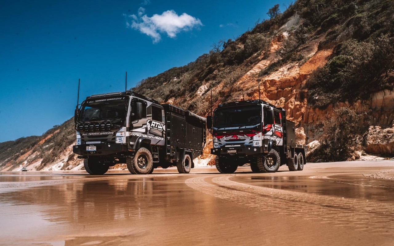 atw expedition trucks on beach